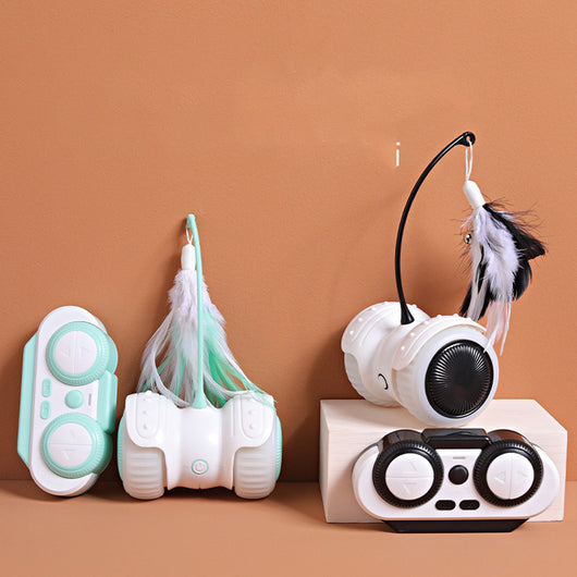 White and mint green remote control cat toy with a feather wand and bell, shown with remote, USB cable, and batteries. - Image 13