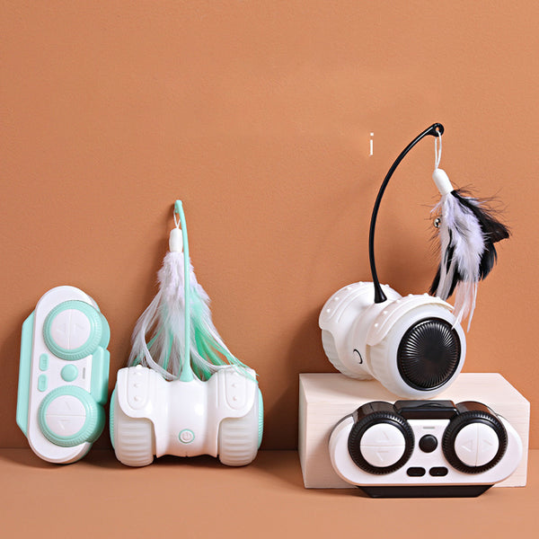 White and mint green remote control cat toy with a feather wand and bell, shown with remote, USB cable, and batteries.