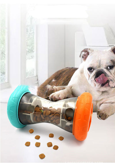Blue and orange pet food leakage toy, shaped like a dumbbell, filled with kibble, with a bulldog in the background. - Image 3