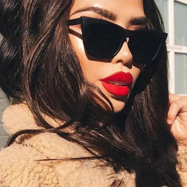 Tortoise shell square sunglasses with brown lenses, featuring a subtle cat-eye shape for a fashionable look.
