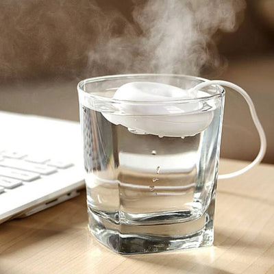 Bright blue donut-shaped mini portable USB air humidifier purifier with a white central filter and silver button. - Image 10