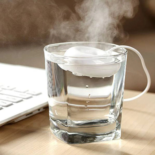 Bright blue donut-shaped mini portable USB air humidifier purifier with a white central filter and silver button. - Image 10
