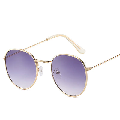 Retro oval sunglasses with pink lenses and a gold metal frame, featuring clear temple tips. - Image 10