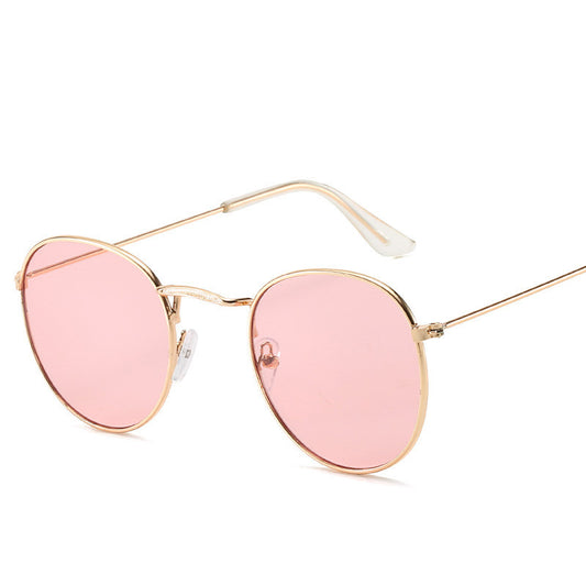 Retro oval sunglasses with pink lenses and a gold metal frame, featuring clear temple tips. - Image 2