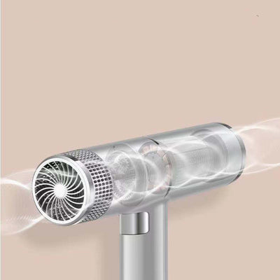 Green and silver compact hair dryer with a T-shaped design, featuring multiple control buttons and a ribbed cord protector. - Image 2