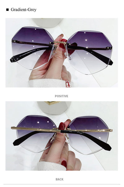 Ladies' cut-edge polygonal sunglasses with gradient purple-to-pink lenses and black temples, held by a hand. - Image 12