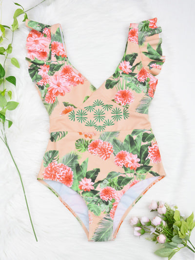 Women's peach one-piece swimsuit with deep V-neck and ruffled straps, featuring a vibrant floral and leaf print. - Image 12