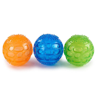 Orange rubber pet toy ball with an openwork design and textured nubs, ideal for puppies' biting and molars. - Image 3