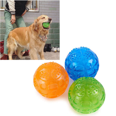 Orange rubber pet toy ball with an openwork design and textured nubs, ideal for puppies' biting and molars.