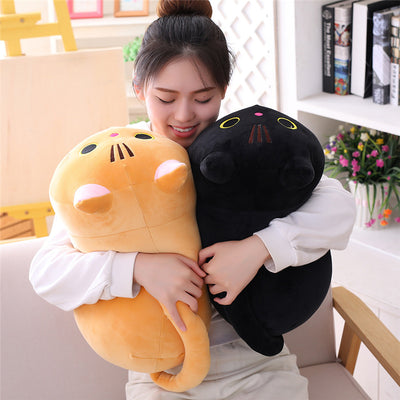 Cute orange cat plush doll with pink ears, black eyes, and embroidered whiskers, resting on a white book. - Image 2