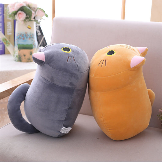 Cute orange cat plush doll with pink ears, black eyes, and embroidered whiskers, resting on a white book. - Image 3