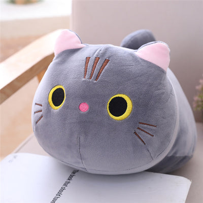 Cute orange cat plush doll with pink ears, black eyes, and embroidered whiskers, resting on a white book. - Image 21