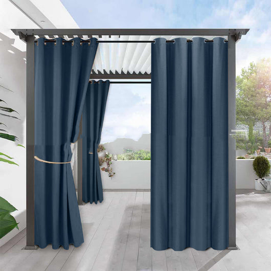 Light gray blackout curtains with grommets hanging from a dark gray pergola on an outdoor patio. - Image 2