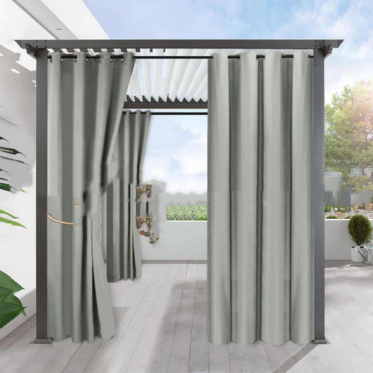 Light gray blackout curtains with grommets hanging from a dark gray pergola on an outdoor patio. - Image 3