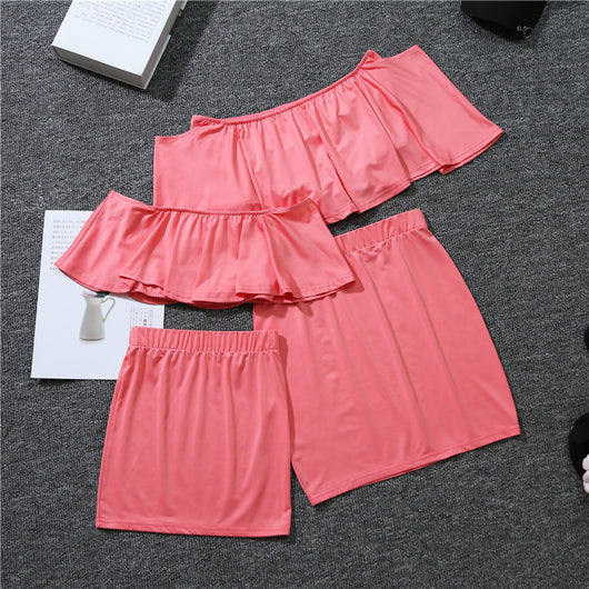 Coral parent-child matching set with an off-the-shoulder ruffled top and a plain mini skirt for mother and daughter. - Image 7