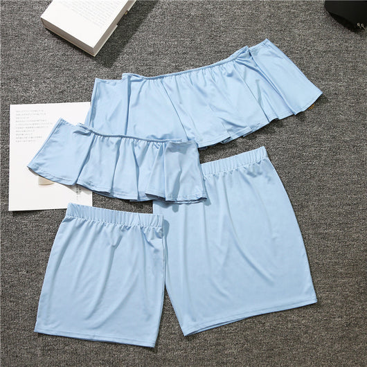 Coral parent-child matching set with an off-the-shoulder ruffled top and a plain mini skirt for mother and daughter. - Image 6