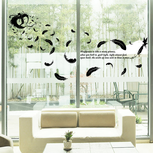 Black feather and fairy wall sticker with an inspirational quote on a teal wall above a patterned sofa. - Image 4
