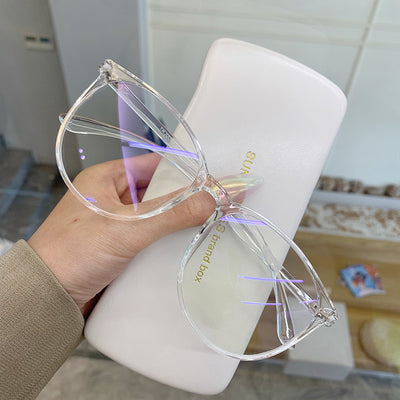 Transparent pink round-face anti-blue light glasses with clear lenses, held against a white glasses case. - Image 4