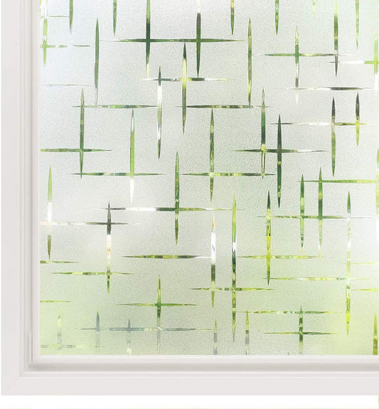 Frosted glue-free window film with a modern geometric pattern of intersecting lines, providing privacy and diffusing light.
