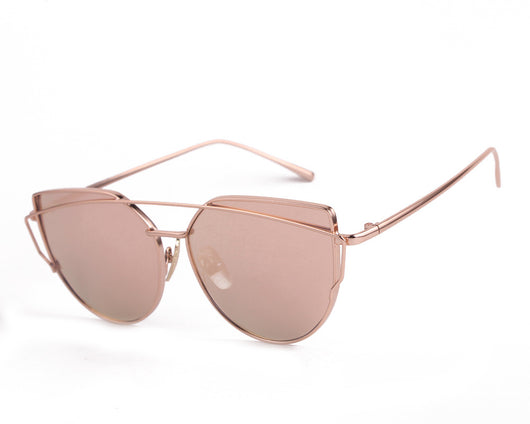 Ultralight women's cat-eye sunglasses with a gold metal frame, dark gray lenses, and a distinctive double bridge. - Image 11