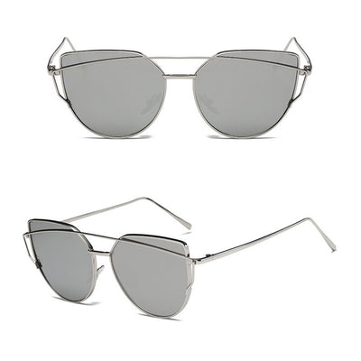 Ultralight women's cat-eye sunglasses with a gold metal frame, dark gray lenses, and a distinctive double bridge. - Image 17