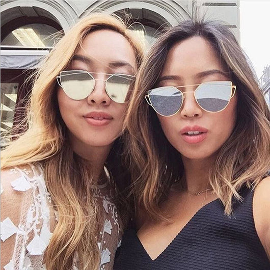 Ultralight women's cat-eye sunglasses with a gold metal frame, dark gray lenses, and a distinctive double bridge. - Image 8