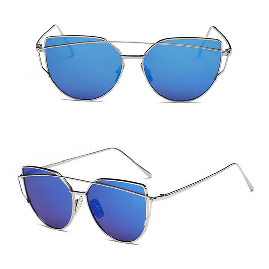 Ultralight women's cat-eye sunglasses with a gold metal frame, dark gray lenses, and a distinctive double bridge. - Image 2