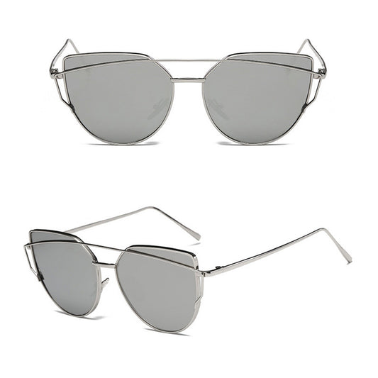 Ultralight women's cat-eye sunglasses with a gold metal frame, dark gray lenses, and a distinctive double bridge.