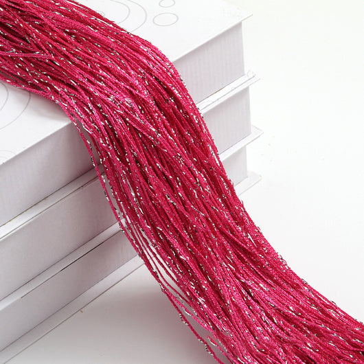 Champagne string curtain with flashing silver metallic threads, draped over white boxes. - Image 33