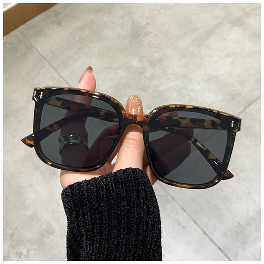 Two pairs of square-frame sunglasses, one with a cream frame and dark lenses, the other with a translucent brown frame and brown lenses. - Image 5
