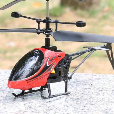 Yellow and black remote control helicopter toy with dual rotors and landing gear, resting on a light outdoor surface. - Image 6