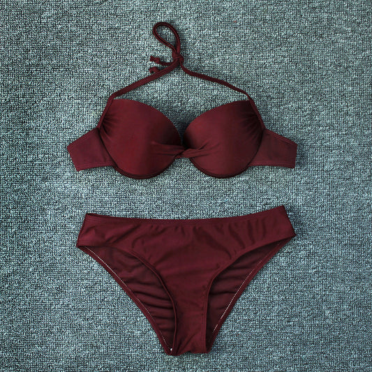 Navy blue solid color bikini swimsuit with a halter neck push-up top and matching classic cut bottoms. - Image 2