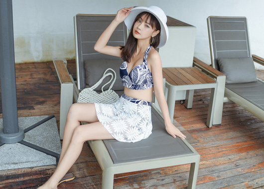 Two women in a three-piece floral swimsuit set with white lace skirts and wide-brim straw hats, posing outdoors. - Image 11