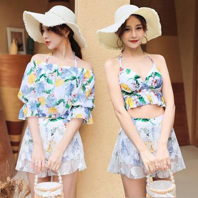 Two women in a three-piece floral swimsuit set with white lace skirts and wide-brim straw hats, posing outdoors. - Image 5