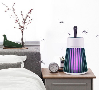 White and grey electric mosquito killer lamp with a purple UV light, featuring a conical cage and top handle. - Image 13