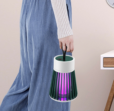 White and grey electric mosquito killer lamp with a purple UV light, featuring a conical cage and top handle. - Image 14