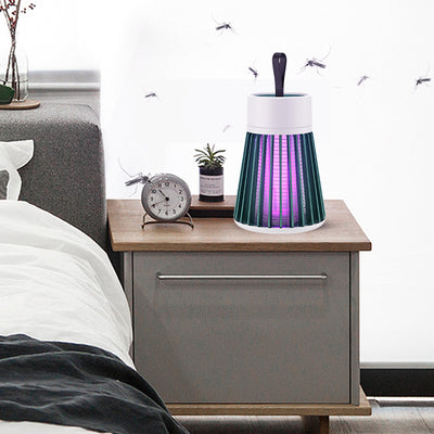 White and grey electric mosquito killer lamp with a purple UV light, featuring a conical cage and top handle. - Image 4