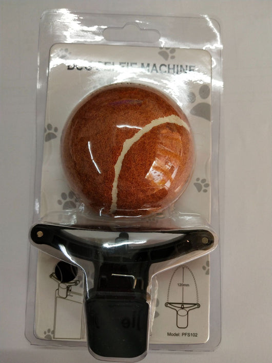 Black pet selfie artifact phone clip with blue accents, holding a bright neon yellow tennis ball, shown attached to a smartphone. - Image 3