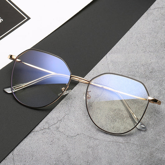 Black metal-framed glasses with irregular polygonal shape and anti-blue light lenses on a two-tone gray and black surface. - Image 2