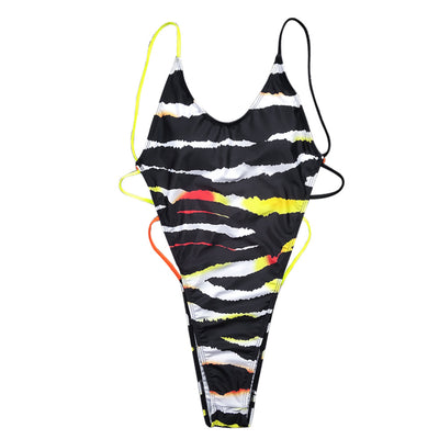 Silver holographic one-piece swimsuit with high-cut leg, V-neck, and braided rope details on the sides.