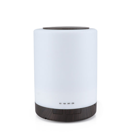 Cylindrical ultrasonic aroma diffuser with a white body and dark wood grain base and top, featuring timer settings.