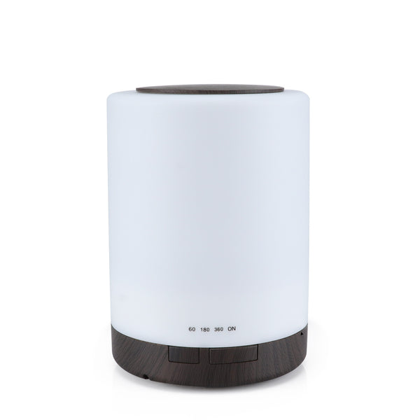 Cylindrical ultrasonic aroma diffuser with a white body and dark wood grain base and top, featuring timer settings.