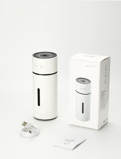 Teal cylindrical USB charging humidifier with a ribbed texture, black water level indicator, and two control buttons. - Image 7
