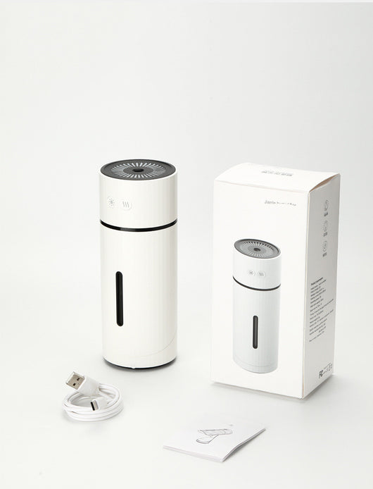 Teal cylindrical USB charging humidifier with a ribbed texture, black water level indicator, and two control buttons. - Image 7
