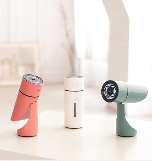 Teal cylindrical USB charging humidifier with a ribbed texture, black water level indicator, and two control buttons. - Image 2