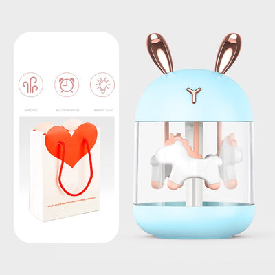 White dream pony humidifier with rose gold deer antlers and a clear tank showing a white carousel pony. - Image 15