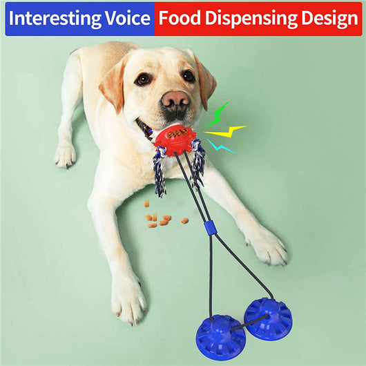 Yellow Labrador Retriever playing with a red and blue suction cup dog toy that dispenses food. - Image 2