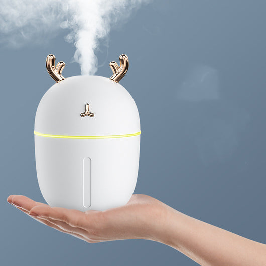Pink egg-shaped humidifier with gold deer antlers, a deer head logo, and a glowing purple light band. - Image 6