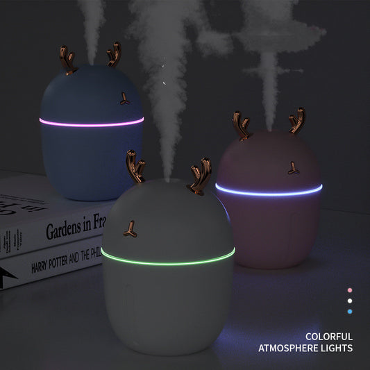 Pink egg-shaped humidifier with gold deer antlers, a deer head logo, and a glowing purple light band. - Image 2