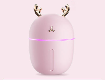 Pink egg-shaped humidifier with gold deer antlers, a deer head logo, and a glowing purple light band. - Image 3